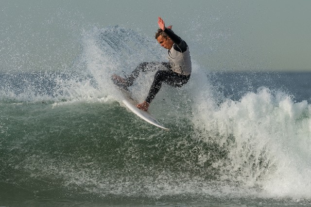 Finn Ketola Surfing front side top turn in manhattan beach california Finn Ketola Surfing front side top turn in manhattan beach california